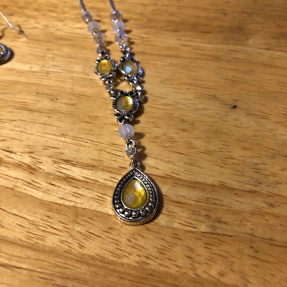 Avon set of earrings and matching necklace. Yellow stones.